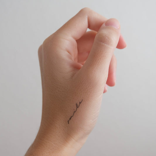 Smile Lettering Tattoo